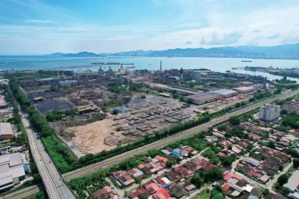 An overhead drone shot of an empty plot of land to be subjected to property valuation in malaysia.